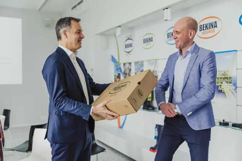 Prime Minister Alexander Decroo getting new Bekina Boots from Thomas Vanderbeke (CEO of Bekina)